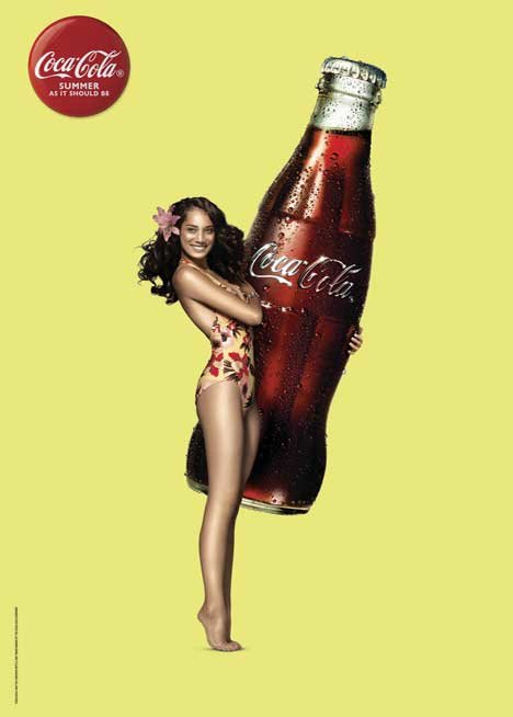 Print adverts - Girl in a swimsuit with a huge bottle of Coca Cola.