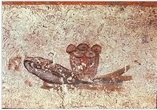 The fish and loaves fresco in San Callisto Catacombs.