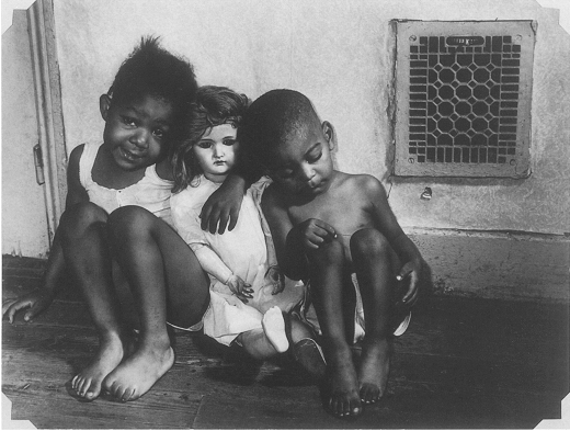 Gordon Parks Photo of two Black kids playing the doll of a White girl.
