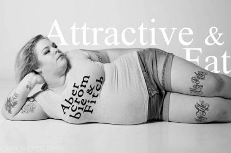 A grey, white and black advert comprising of a plus-sized woman lying down on her right side.