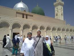 Three people take a photo in Medina