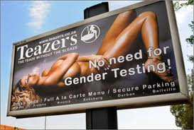 Billboard advertising with nude seductive women.
