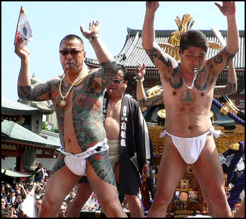 Yakuza members participating in a Local Festival.