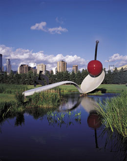 Huge spoon (in the form of the bridge through a little pond) with a cherry on its top.