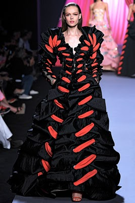 A model in a dress on the Viktor and Rolf fashion show.