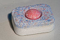 A dish washer detergent tablet.