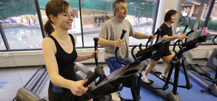 Physical activities - people train on treadmills.