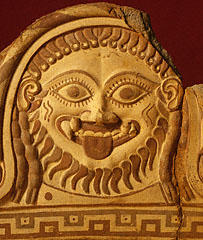 An Etruscan Terracotta fragmentary roof ornament that has an image of Medusa