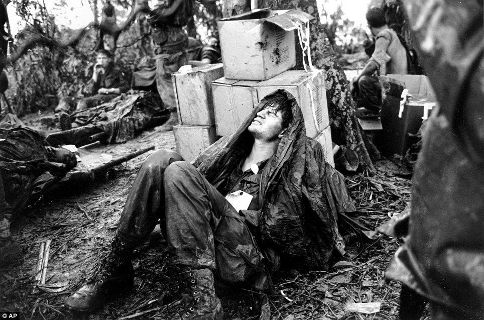 A wounded soldier awaits medical evacuation in the Shau Valley