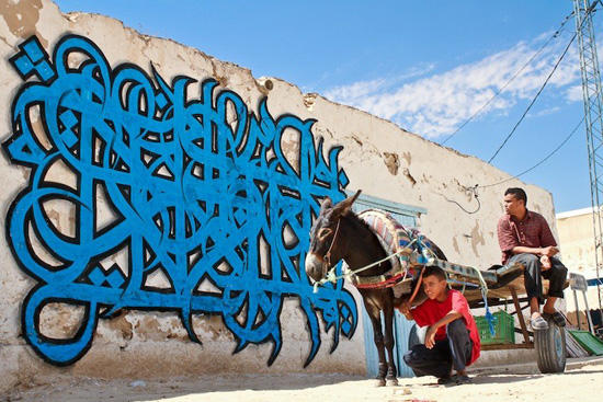 An artist mixes calligraphy with graffiti.