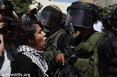 Confrontation between unveiled Palestinian women and the occupation.