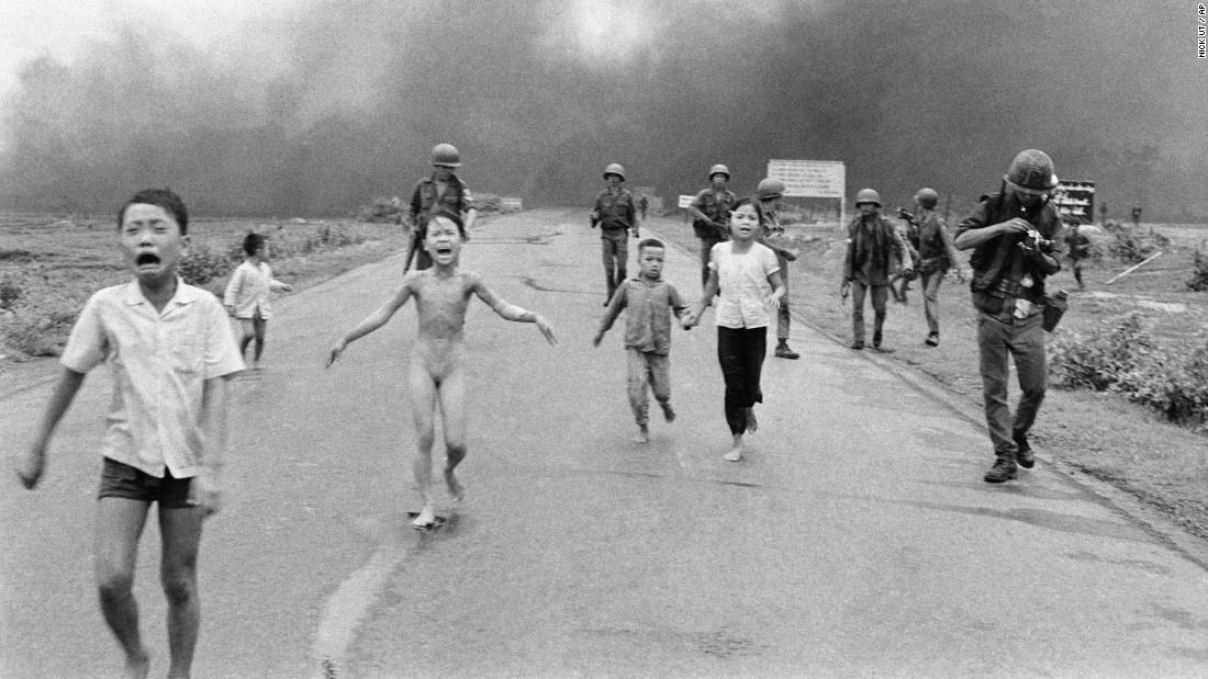 South Vietnamese Forces Follow after Terrified Children after a Napalm Attack on Suspected Viet Cong Hiding.