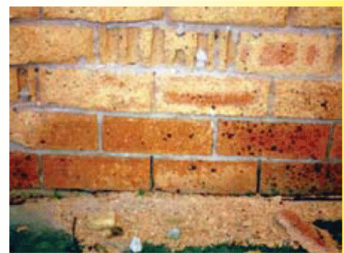 shows the effects of fretting on brickwork.