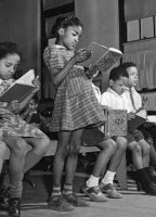 African American children studying religion.