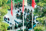 Iranian security personnel sit in front of the parliament building on Wednesday, where witnesses reported protesters gathered late in the day.