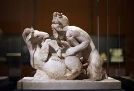 Sculpture of a man copulating with a goat.