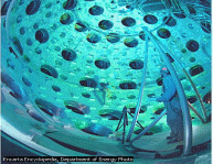  Engineer standing inside the target chamber of the National Ignition Facility