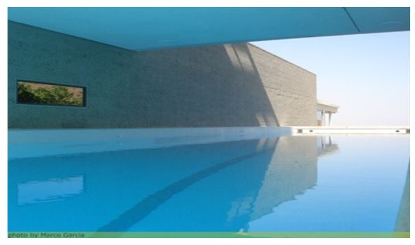 The swimming pool showing the house bridging over it