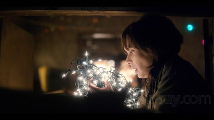  Character Joyce Byers holding Christmas Lights