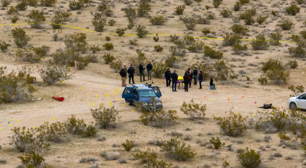 Garcia, Karen, et al. "San Bernardino County Sheriff's Department officials investigate a scene on Wednesday, where six people were found dead in the community of El Mirage." 